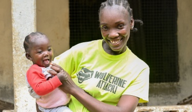 Rachel holding her child