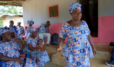 Cecelia Green standing at Gedetarbo Women's Group meeting