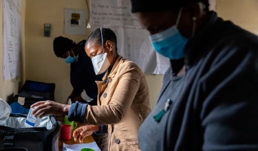 treatment supporters prepare tb medication packages