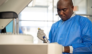 Jean Cosley Gustinvil works in the laboratory at Hôpital Universitaire de Mirebalais in Haiti.
