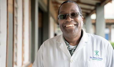 Dr. Sterman Toussaint smiles