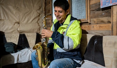 Elvis Espinosa holds his saxophone, an instrument he thought he'd never touch again after he was diagnosed with extensively drug-resistant tuberculosis. 