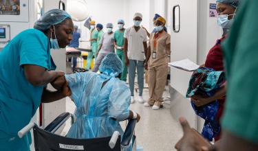 Patient Fanta Jimmy heads into the operating theater