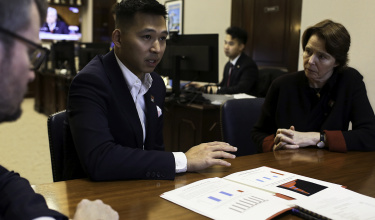 Vincent Lin, associate director of health policy and advocacy, center, and PIH Co-founder Ophelia Dahl, right, speak with a representative from the office of Senator Christopher Coons in Washington, D.C.