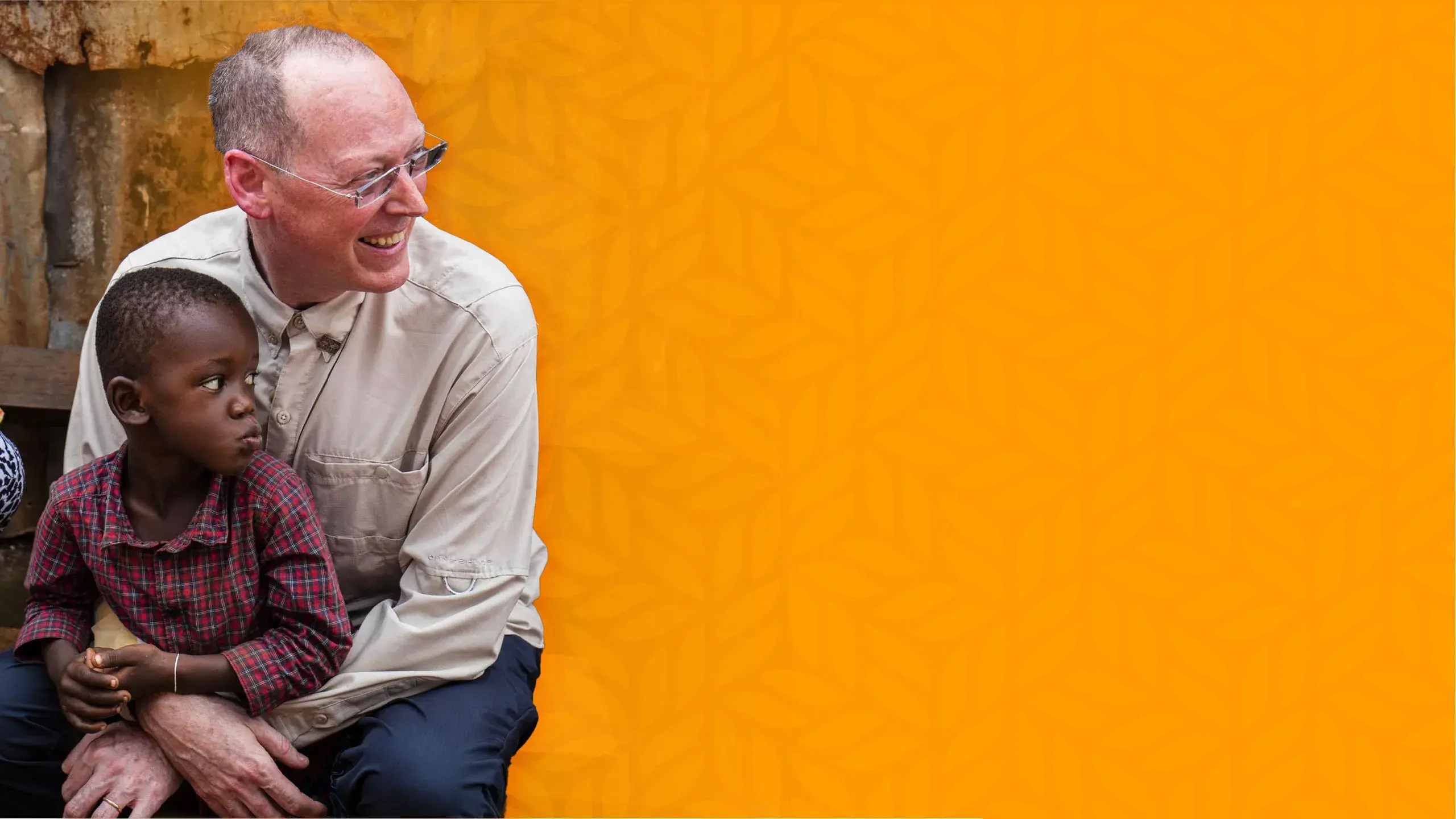 Dr. Paul Farmer sharing a moment with a child