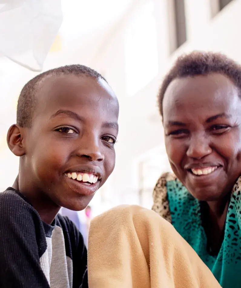 A mother and child in the pediatric oncology hospital ward.