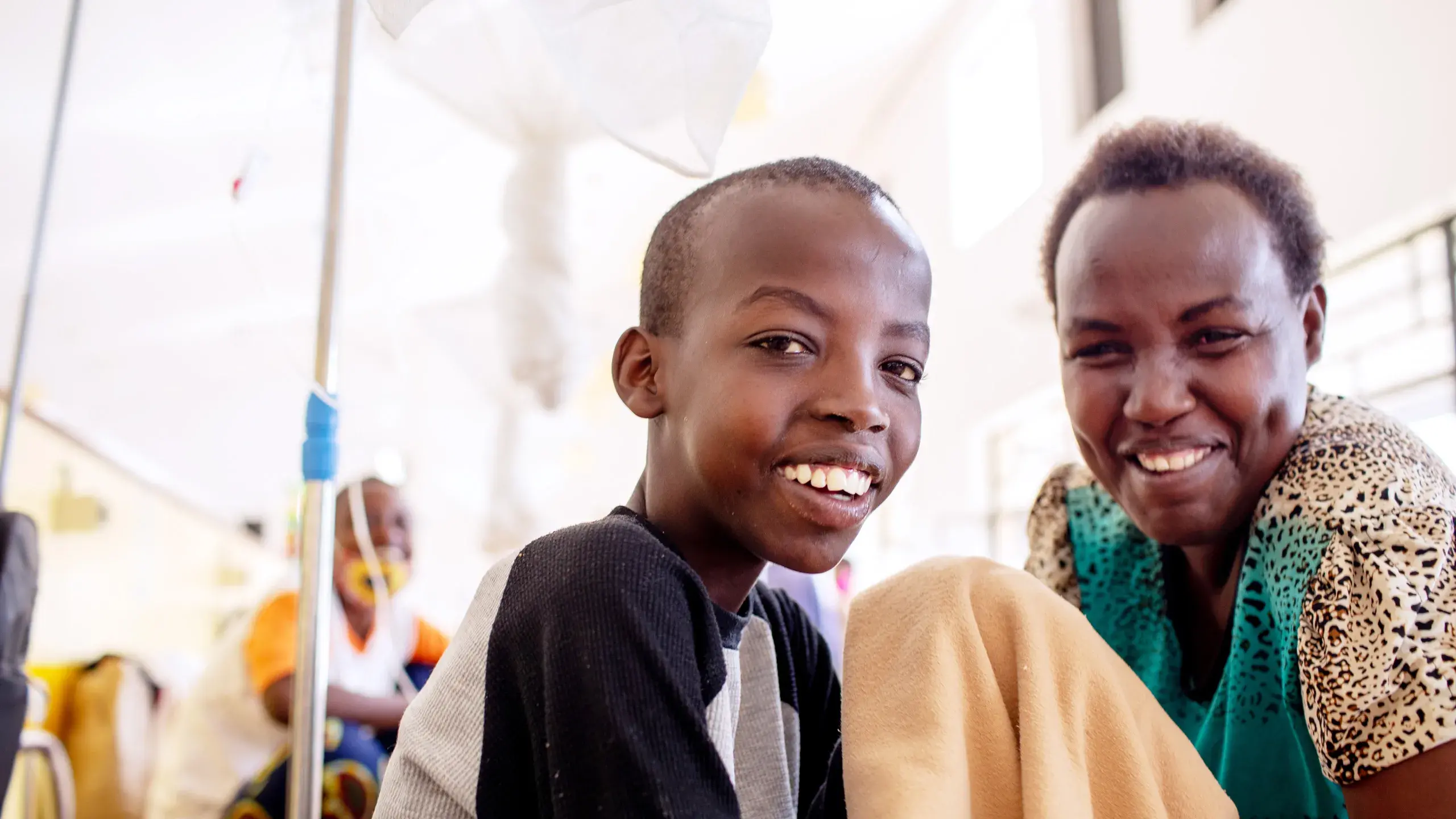 A mother and child in the pediatric oncology hospital ward.